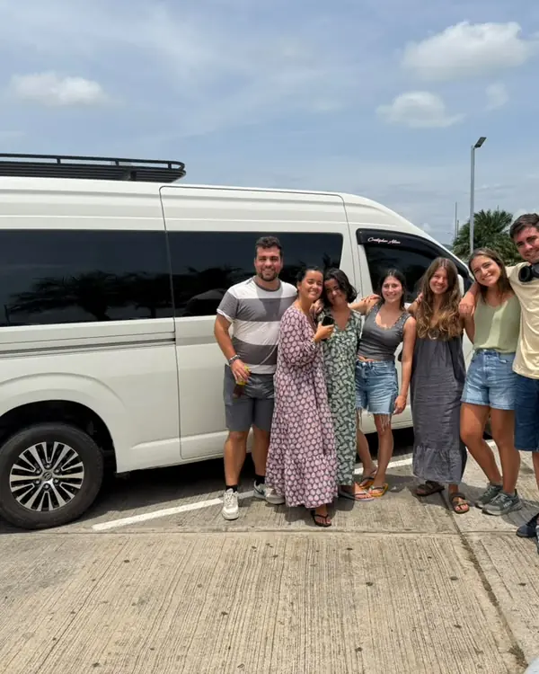 Travelers next to our van before a transfer