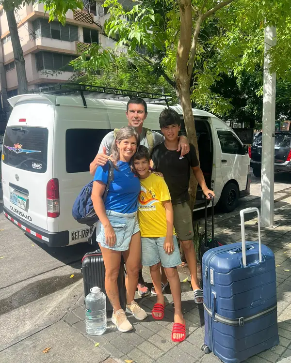 Travelers next to our van before a transfer