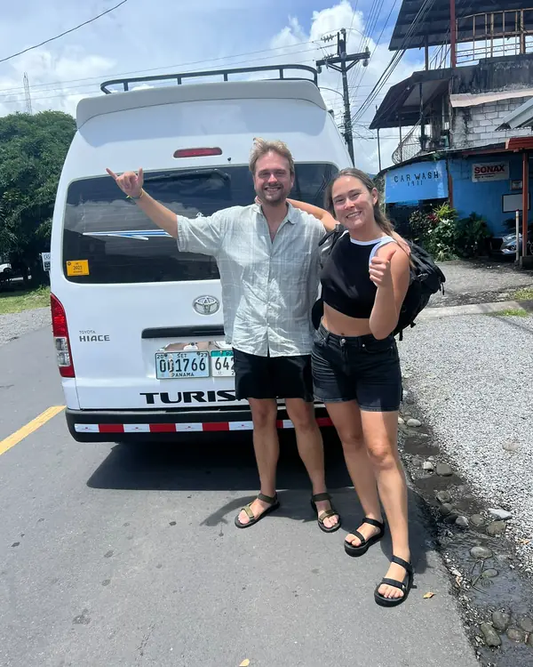 Travelers next to our van before a transfer