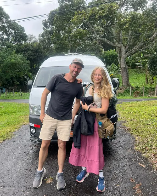 Travelers next to our van before a transfer