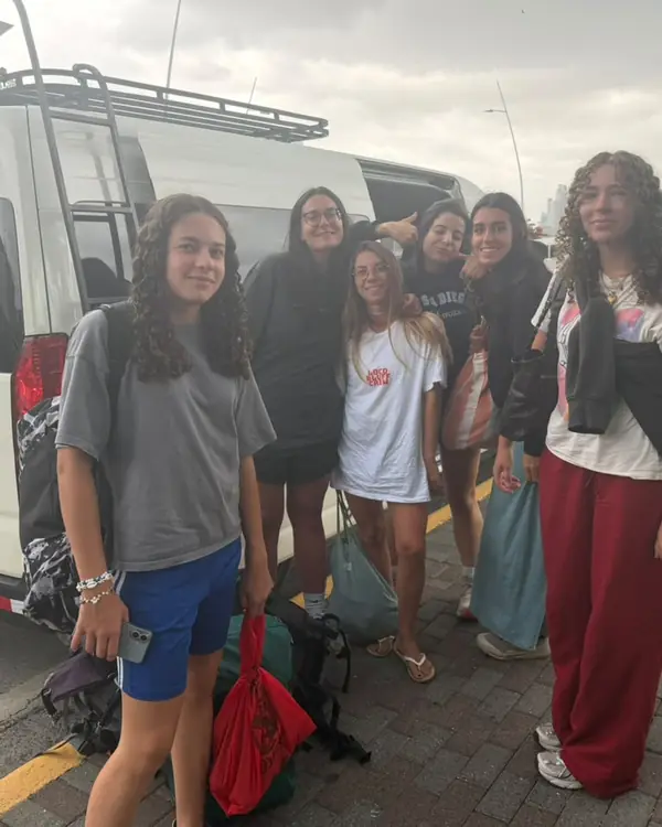 Travelers next to our van before a transfer