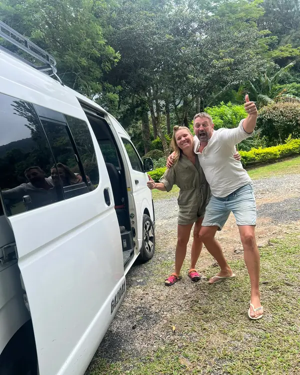 Travelers next to our van before a transfer